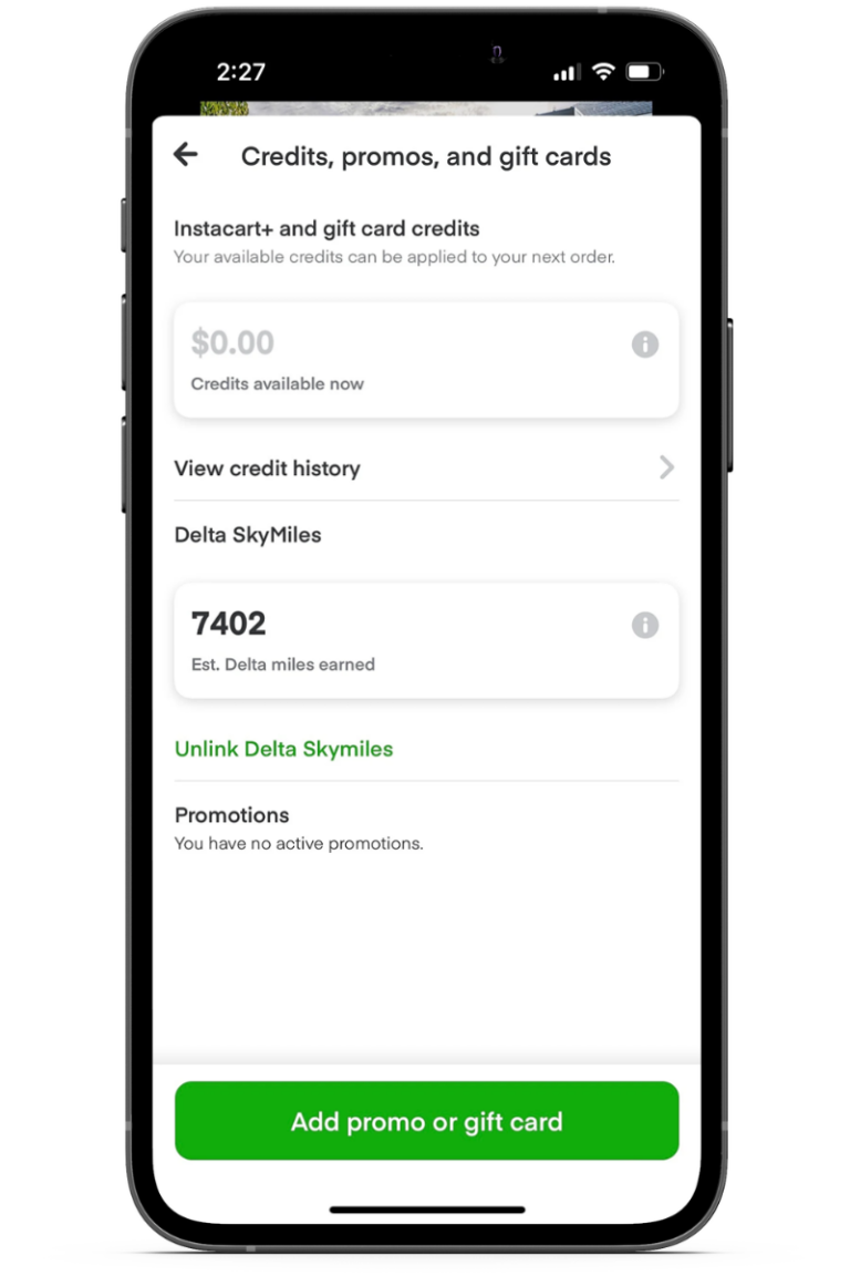 Phone with Instacart digital wallet displayed with Delta Skymiles earned